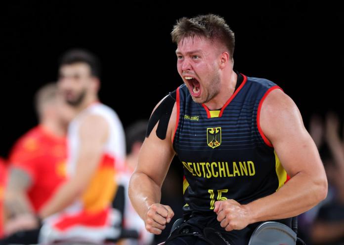 A male athlete reacting 